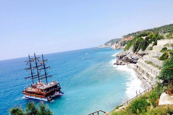 Alanya Catamaran Boat Tour with Sunbathing Swimming & Snorkelling - Leaving Alanya Limanı: Red Tower, Old Shipyard, and Castle Views