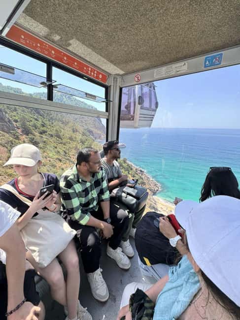 Alanya Night City Tour: Castle, Cleopatra Beach & Cable Car - Group tour reality: languages, pacing, and guide style