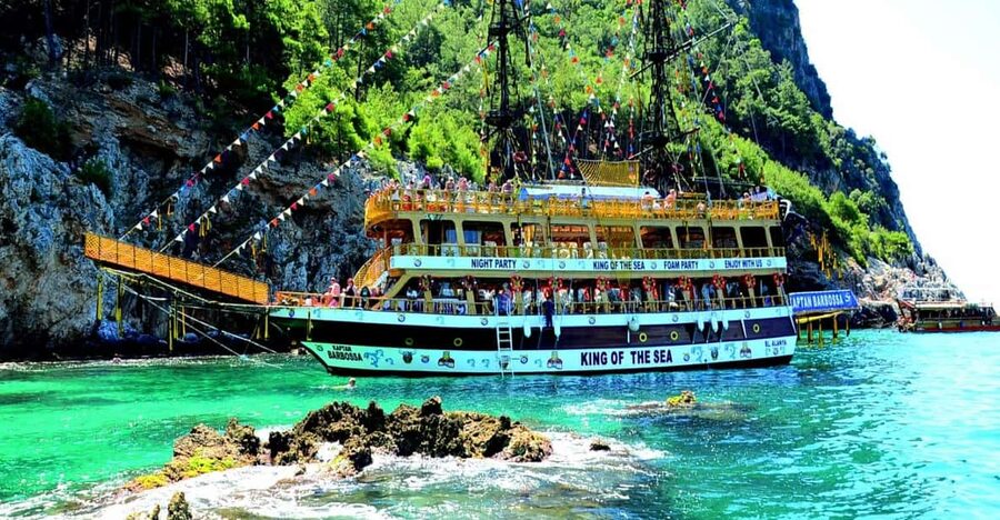 Alanya: Pirates Boat Trip with Lunch and Hotel Pickup - Cave stops, a photo moment, and the swim by Alanya Castle