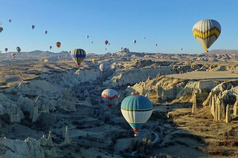Cappadocia: Sunrise Hot Air Balloon Watching Tour - From launch to sunrise: seeing the balloons rise over Cappadocia valleys