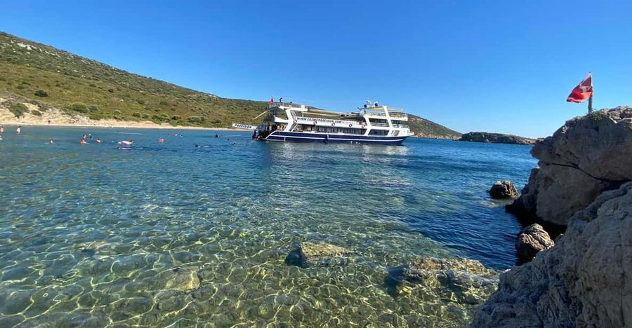 Cesme: Islands and Bays Boat Trip with BBQ Lunch - The changing stops: Coral, Paradise, Winter Bay, Macri Island, and why weather rules