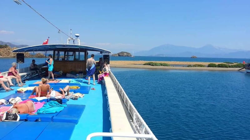 Fethiye: 12 Islands Boat Tour with Lunch and Hotel Transfer - Swimming stops and how the captain builds your day