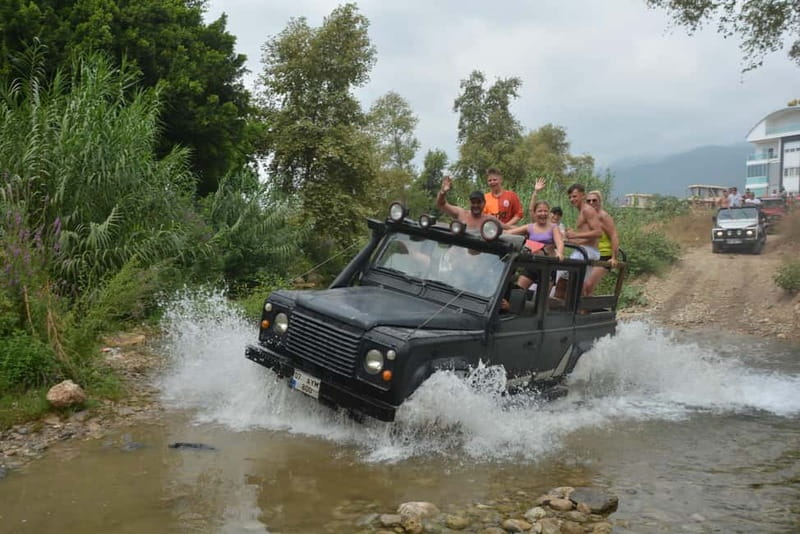 From Alanya: Jeep Safari with Lunch, Dim River & Cave - Getting picked up and riding the open Land Rover
