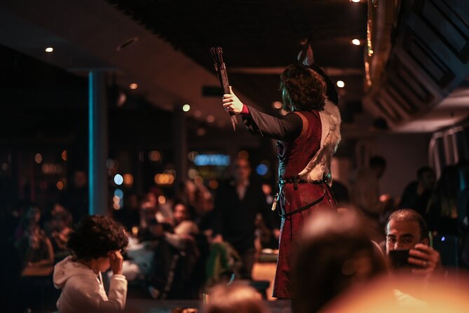Istanbul Bosphorus Dinner Cruise: Live Folk Dance & DJ Experience - Beylerbeyi and Dolmabahçe Palaces lit up along the route