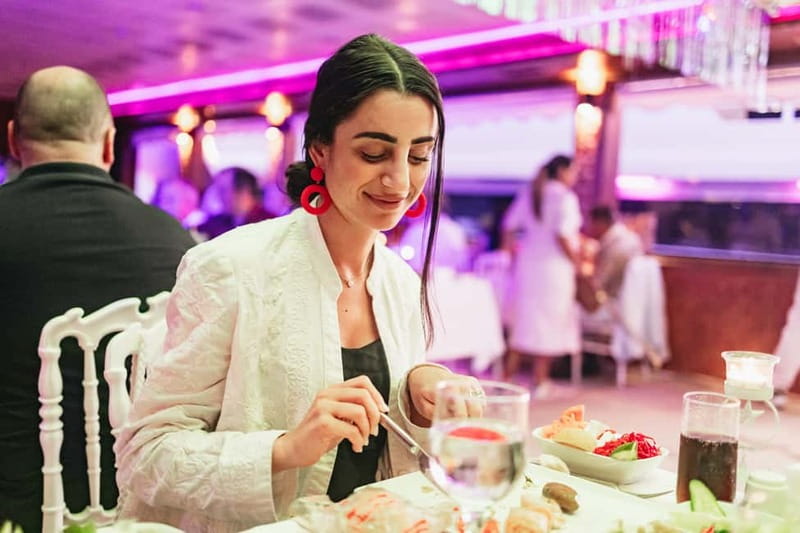 Istanbul: Bosphorus Dinner Cruise & Show with Private Table - The dinner menu: mezes, hot starters, mains, and seasonal fruit