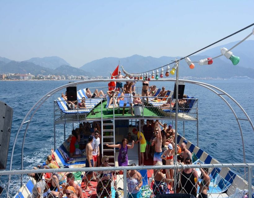 Kusadasi: Full-Day Boat Cruise w/ Lunch & Hotel Pickup - Lunch on the Water: BBQ and Soft Drinks, Right After Stop One