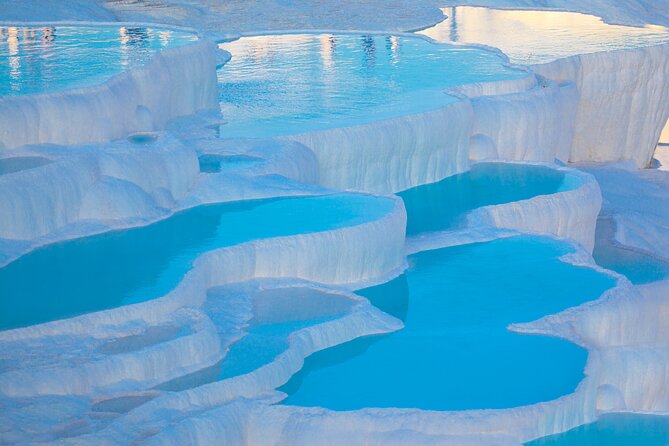 Pamukkale and Hierapolis Daily Tour From Antalya - Hierapolis: amphitheater views and what a guide adds
