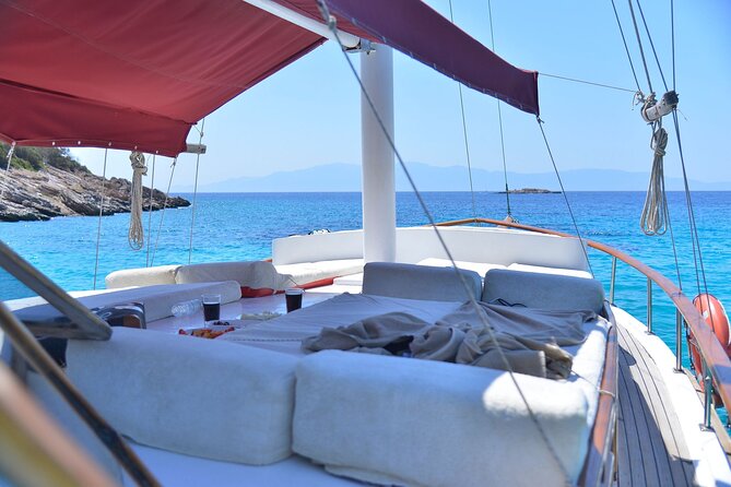 Private 6-Hour Boat Tour with Lunch in Bodrum Bays - Stop three at Rabbit Bay: fruit, Blue Flag water, and photo time
