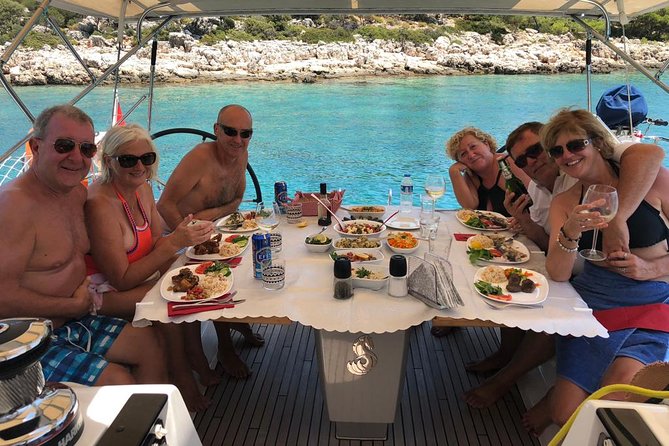 Sailing Day Tour with skipper and private chef in Kas Islands - Stop 3: Inönü Koyu lunch, swim break, and a boat kitchen doing real work